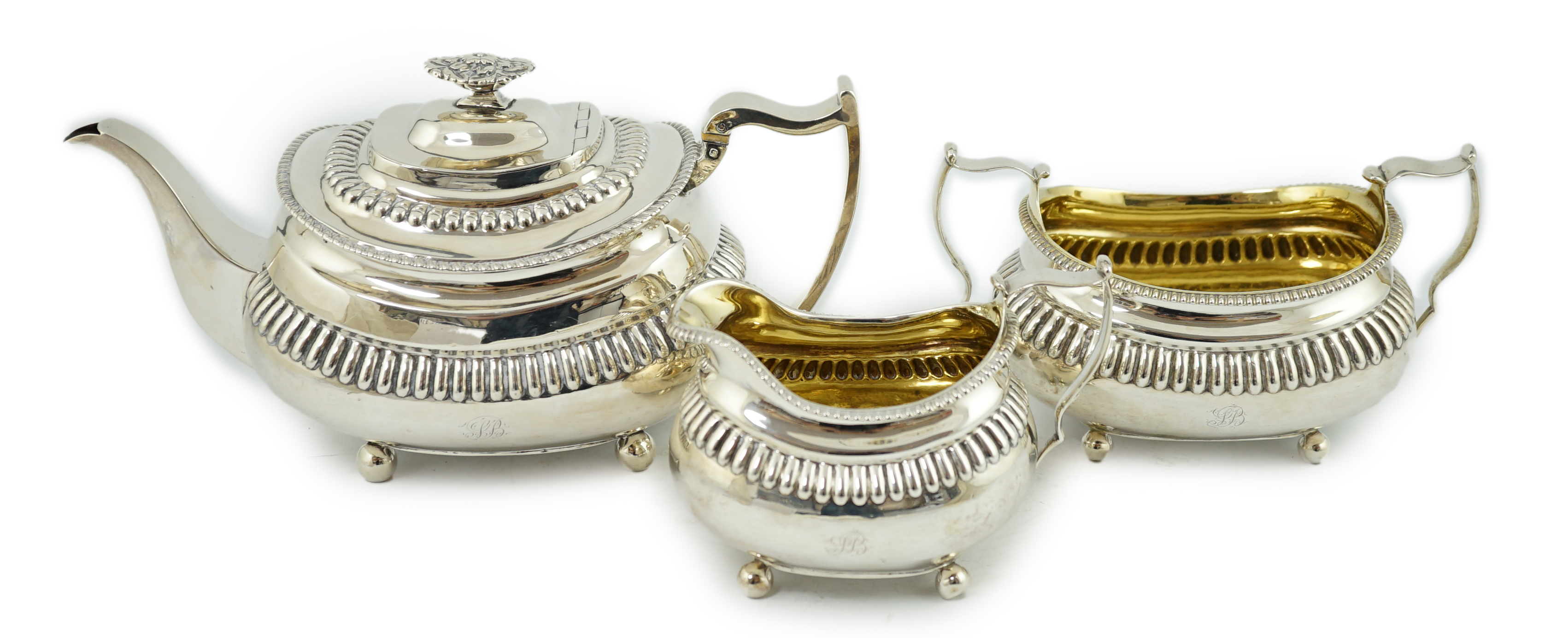 A George III silver three piece tea set, by Soloman Hougham